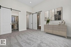 Spacious room featuring light gray carpeting and white walls - 
