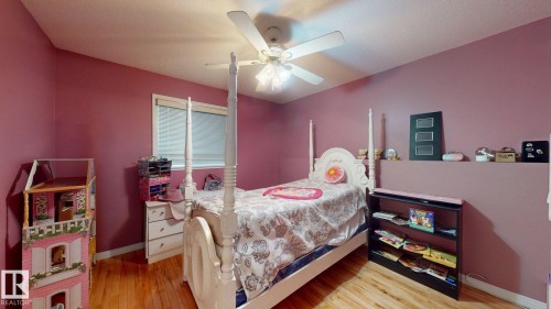 Hardwood flooring and a ceiling fan with integrated lighting - 3738 28A Street, Edmonton, AB 