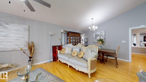 Vaulted ceilings, wood-finish flooring, and a contemporary ceiling fan - 3738 28A Street, Edmonton, AB 