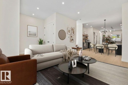 Open-concept living space featuring recessed lighting, light wood-finish flooring, and a neutral color palette - 10932 132 Street, Edmonton, AB - Indoor Photo Showing Living Room