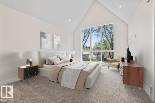 Soaring vaulted ceiling in a bedroom featuring a large picture window, recessed lighting, neutral carpeting, and white walls - 10932 132 Street, Edmonton, AB - Indoor Photo Showing Bedroom