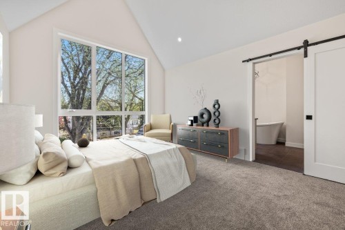 Bedroom featuring vaulted ceilings and a large multi-pane window - 10932 132 Street, Edmonton, AB - Indoor Photo Showing Bedroom