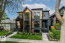 Modern facade featuring expansive window banks, mixed material siding, and a gabled entry - 10932 132 Street, Edmonton, AB  - Outdoor With Facade 