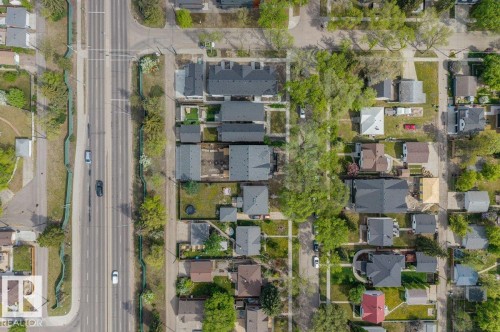 Aerial view showcasing residential properties with varying roof styles and established landscaping - 10932 132 Street, Edmonton, AB -  With View