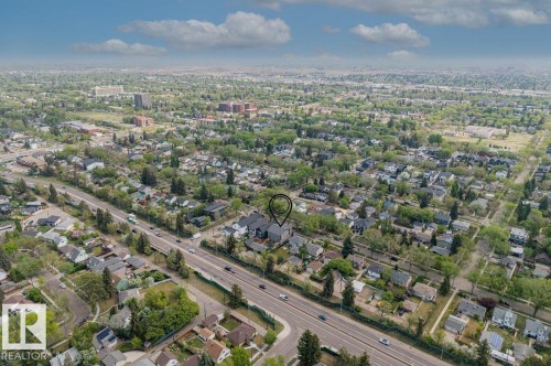 Aerial perspective highlighting a residential area with varied architectural styles and mature tree cover - 10932 132 Street, Edmonton, AB - Outdoor With View