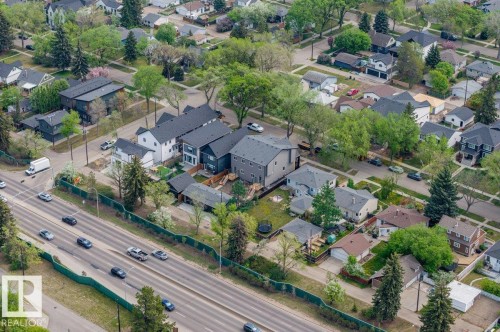Residential area featuring a variety of architectural styles, mature trees, and a multi-lane thoroughfare - 10932 132 Street, Edmonton, AB - Outdoor With View