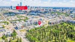 Aerial perspective featuring a residential building surrounded by mature trees - 