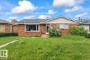Brick facade home with white siding gable - 8736 72 Street Nw, Edmonton, AB  -  With View 
