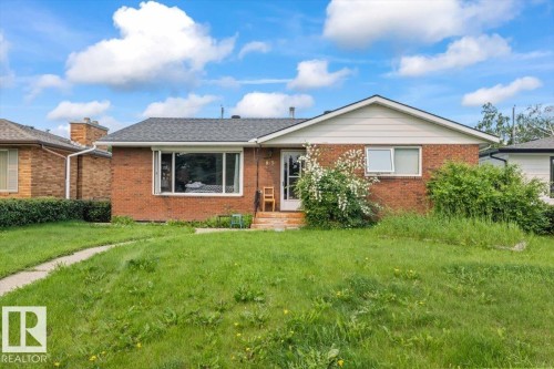 Brick facade home with white siding gable - 8736 72 Street Nw, Edmonton, AB - Outdoor