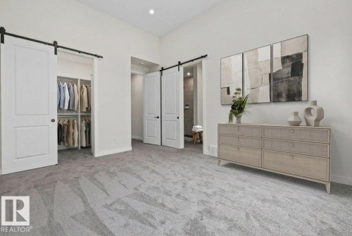 Spacious room featuring light gray carpeting and white walls - 10934 132 Street, Edmonton, AB - Indoor