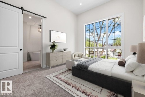 Spacious room featuring vaulted ceilings, a large grid-pane window, and plush carpet flooring - 10934 132 Street, Edmonton, AB - Indoor Photo Showing Bedroom