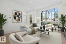 Spacious living area featuring expansive grid-pattern windows, recessed lighting, wood-finish flooring, and a white color palette - 10934 132 Street, Edmonton, AB  - Indoor Photo Showing Living Room 