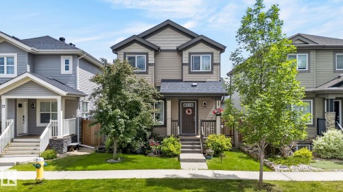 Two-story residential property featuring a multi-toned facade with vertical and horizontal siding - 33 Durrand Bend, Fort Saskatchewan, AB 
