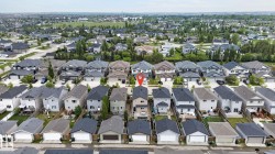 Aerial perspective showcasing a residential neighborhood with detached homes - 