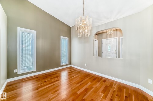 Vaulted ceiling with an elegant tiered chandelier - 29 929 Picard Drive, Edmonton, AB - Indoor Photo Showing Other Room
