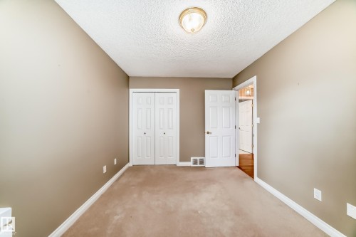 Neutral-toned room featuring beige carpeting and light tan walls - 29 929 Picard Drive, Edmonton, AB - Indoor Photo Showing Other Room