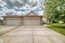 Concrete driveway with an integrated stone-filled drainage channel - 29 929 Picard Drive, Edmonton, AB  - Outdoor 