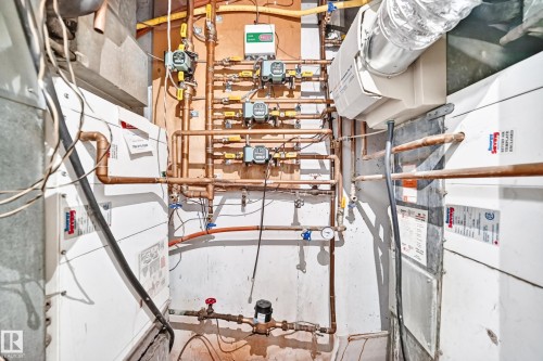 Comprehensive mechanical systems featuring copper piping, multiple control units, and white paneling - 199 Westridge Road, Edmonton, AB 