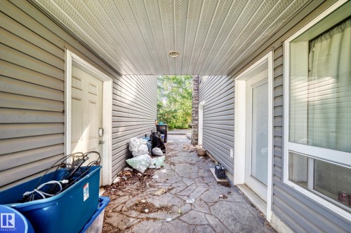 Covered outdoor walkway featuring textured stone-look paving - 199 Westridge Road, Edmonton, AB 