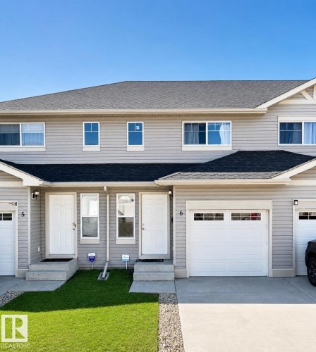 Modern duplex exterior with light gray horizontal siding - 6 18004 89 Street, Edmonton, AB 