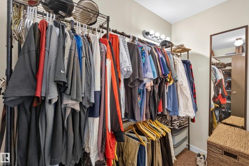 Configurable closet system featuring multiple hanging rods and integrated shelving - 12062 157 Avenue, Edmonton, AB 