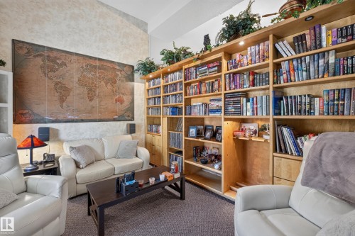 Built-in wood shelving with integrated lighting provides extensive storage - 12062 157 Avenue, Edmonton, AB 
