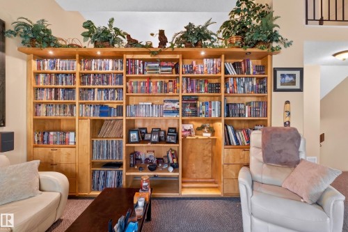 Custom built-in wood-finish shelving with integrated lighting - 12062 157 Avenue, Edmonton, AB 