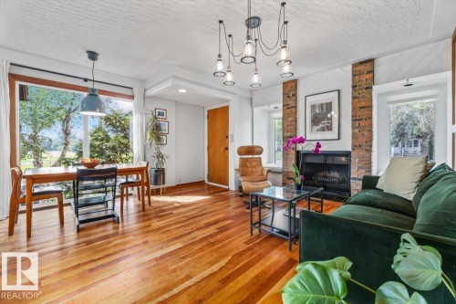 Open-concept living space with wood-finish flooring - 11603 70 Street Nw, Edmonton, AB 