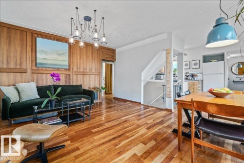 Living and dining area featuring wood-finish flooring - 11603 70 Street Nw, Edmonton, AB 