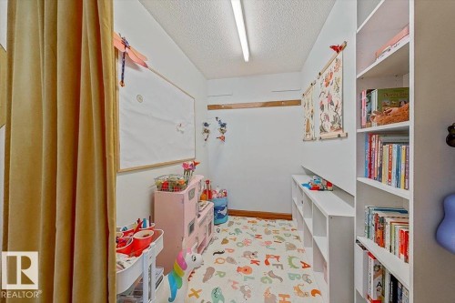 Dedicated room with track lighting and an expansive whiteboard - 11603 70 Street Nw, Edmonton, AB 