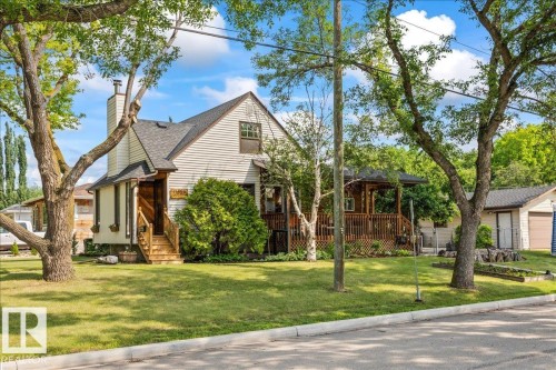 Siding exterior with dormer window and dark-shingle roof - 11603 70 Street Nw, Edmonton, AB 