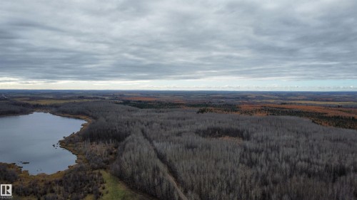 Expansive natural landscape featuring a sizable lake and dense tree cover - Rge Rd 62, Rural Barrhead County, AB 