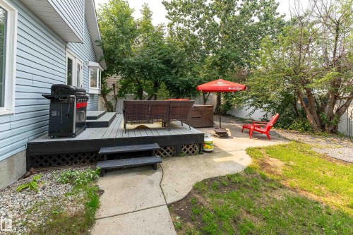 Multi-level deck with gray composite decking and a bay window - 14 Durand Place, St. Albert, AB 