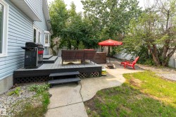 Multi-level deck with gray composite decking and a bay window - 