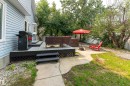 Multi-level deck with gray composite decking and a bay window - 14 Durand Place, St. Albert, AB 