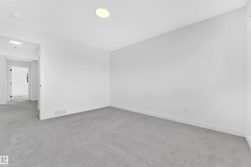 Carpeted interior space featuring white walls and recessed ceiling lighting - 523 Kleins Court, Leduc, AB - Indoor Photo Showing Other Room