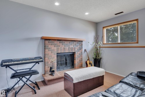 3806 33 Avenue, Leduc, AB - Indoor Photo Showing Living Room With Fireplace