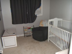 Light gray walls complement the carpeted flooring - 
