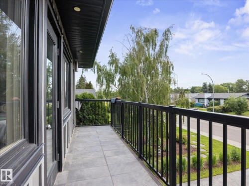 Outdoor balcony with dark tile flooring and black metal railing - 8822 161 Street, Edmonton, AB 