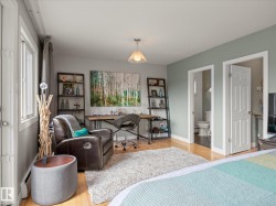 Hardwood-style flooring throughout with light-colored walls and white trim - 