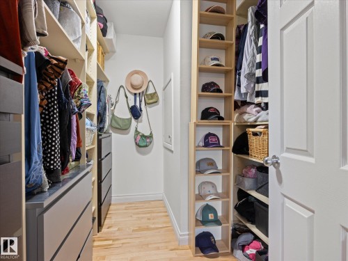Custom closet organization system featuring light wood-finish flooring - 8822 161 Street, Edmonton, AB 