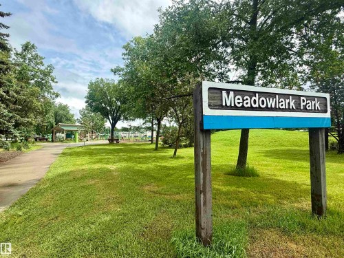 Meadowlark Park sign with a wooden frame and white and blue accents - 8822 161 Street, Edmonton, AB 