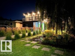 Contemporary exterior featuring a second-story balcony with metal railings - 