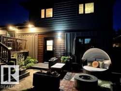 Exterior patio featuring a tiled surface and integrated lighting - 