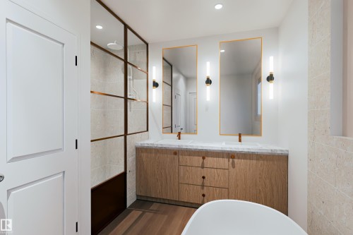 Dual vanity with wood-finish cabinetry and white countertops, accented by gold-framed mirrors and vertical sconces - 9134 104 Street, Morinville, AB 