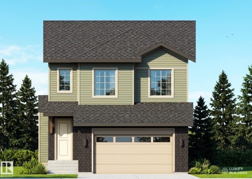 Two-story residence featuring green horizontal siding and dark brick accents - 9134 104 Street, Morinville, AB 