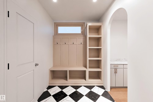 Built-in shelving and bench storage with coat hooks - 9134 104 Street, Morinville, AB 