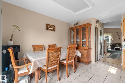Dining area featuring neutral wall tones, tile flooring, and a recessed ceiling light - 18126 98 Avenue, Edmonton, AB 
