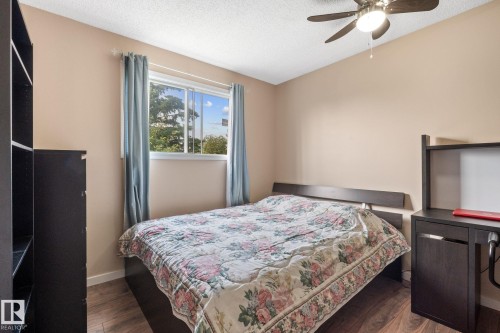 Room featuring wood-finish flooring, a contemporary ceiling fan, and a window with natural light - 18126 98 Avenue, Edmonton, AB 