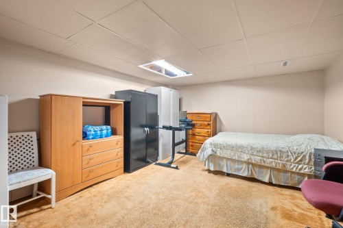 Carpeted room with a drop ceiling and recessed lighting - 18126 98 Avenue, Edmonton, AB 